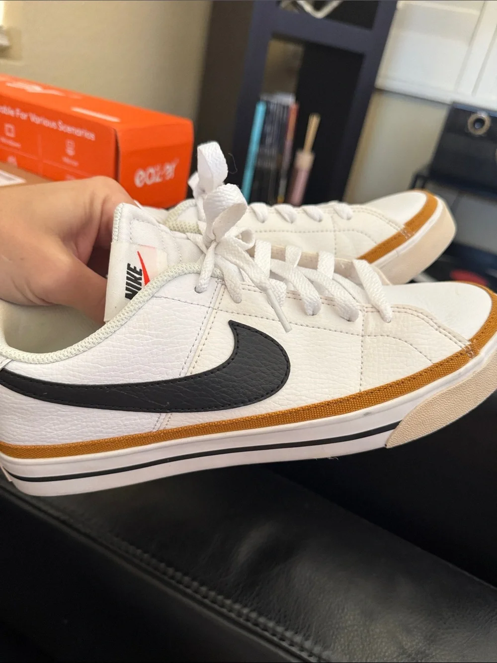 Nike White Low-Top Sneakers with Black Swoosh and Brown Trim